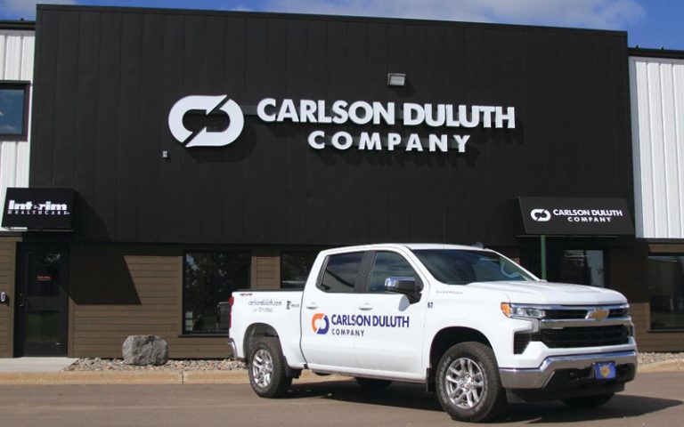 Carlson Duluth Company shop on Venture Ave with a company service truck